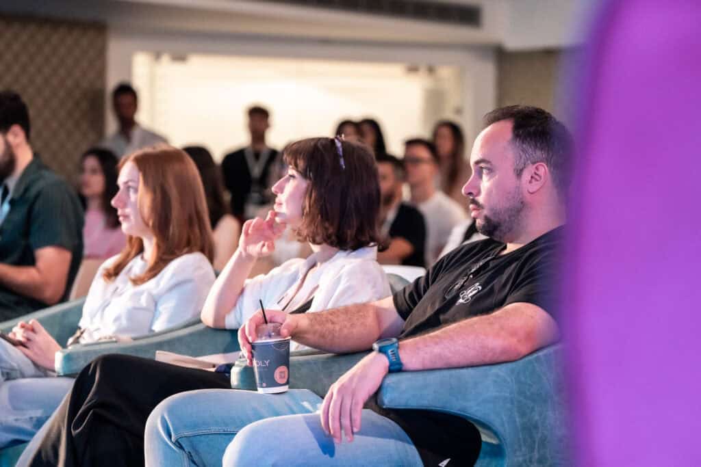 Attendees fully immersed in the talk, taking in every word with complete concentration.